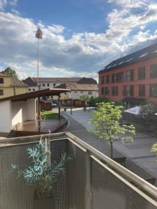 a view of a courtyard with buildings and trees at Apartmán Karo, oddych v centre Oščadnice in Oščadnica