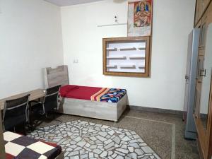 Cama o camas de una habitación en Pratima Boys Pg