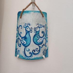 a blue and white towel hanging on a wall at Agriturismo Quattro Mori in Porto Torres