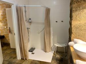 a bathroom with a shower and a sink at Hotel Pazo de Bieite in Boimorto