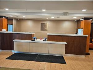 a lobby with a reception desk in a hospital at Comfort Inn & Suites Ankeny - Des Moines in Ankeny +37 photos