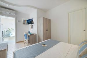 Postel nebo postele na pokoji v ubytování Hotel Soffio D'Estate