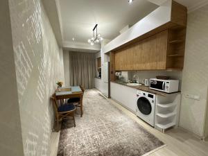 BAURUM Family Apartments tesisinde mutfak veya mini mutfak