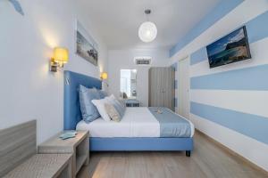 Postel nebo postele na pokoji v ubytování Hotel Soffio D'Estate