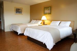Postel nebo postele na pokoji v ubytování Motel 6 Tremonton, Utah