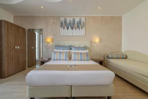Postel nebo postele na pokoji v ubytování Hotel Soffio D'Estate