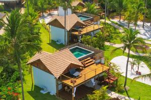 an aerial view of a resort with a swimming pool at Pousada Reserva do Patacho in Pôrto de Pedras