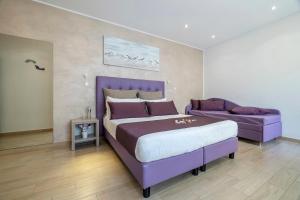Postel nebo postele na pokoji v ubytování Hotel Soffio D'Estate