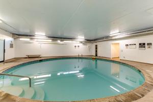 a large swimming pool in a large room at Sand & Sea: Room 308 in Seaside