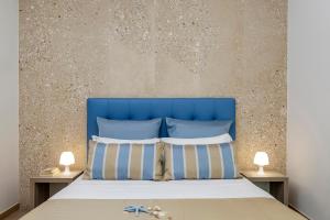 Postel nebo postele na pokoji v ubytování Hotel Soffio D'Estate