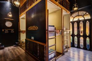 a room with shelves and a clock on the wall at The Clock Hostel & Suites in Cartagena de Indias