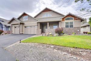 a large house with a driveway in front of it at Redmond Golf Getaway - Near Smith Rock State Park! in Redmond