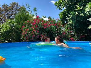 a woman in a swimming pool with a float at Dramalj Queen in Dramalj