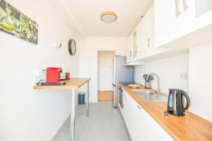 Una cocina o zona de cocina en Vieux-Port - Vue exceptionnelle - 2 ch et clim
