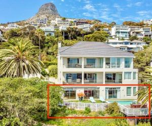 a large white house on top of a hill at Private Pool! Bantry Bay Large Flat with Solar in Cape Town