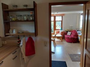 a room with a kitchen and a living room at Alpenblick in Nordschwaben