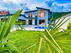 a villa with a view of the house at Qafqaz Modern Harmony in Gabala