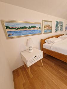 Postel nebo postele na pokoji v ubytování Apartments Podlesek
