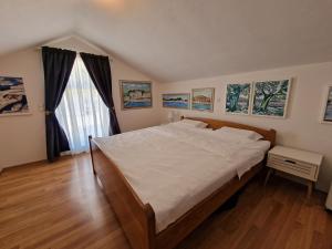 Postel nebo postele na pokoji v ubytování Apartments Podlesek