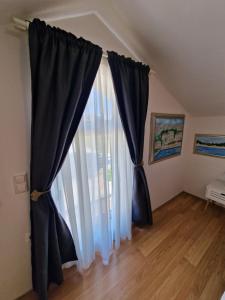Postel nebo postele na pokoji v ubytování Apartments Podlesek
