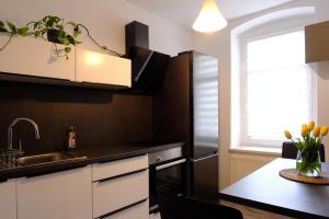a kitchen with a sink and a refrigerator at Urlaub nicht nur für Monteure "G1" in Gera