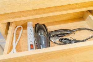 a cuisinart router in a wooden drawer at Urban Oasis Luxe Glamping with King Bed & BBQ in Glendora