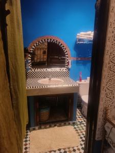 a bathroom with a sink and a toilet at Riad Lalla Zoubida in Fez