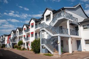 a row of houses with balconies on a street at Laguna Grove 14 in Knysna