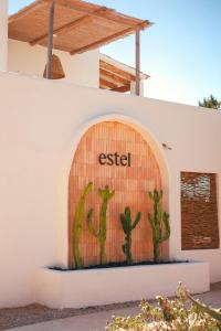 a cactus mural on the side of a building at Estel Formentera in Playa Migjorn