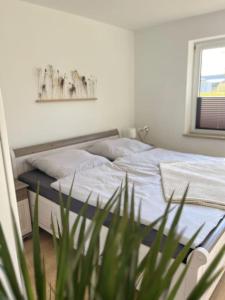 Postel nebo postele na pokoji v ubytování Ferienwohnung Nordlicht