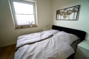 Postel nebo postele na pokoji v ubytování Ferienwohnung Nordlicht