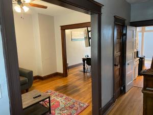 a living room with a door leading to a dining room at 3 BR TH fee Parking Walk 2 Metro in Washington