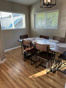 a dining room with a table and chairs at Private Cabin 21 with Jacuzzi Pet Friendly in Smith River +14 photos