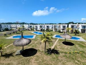 an image of a resort yard with umbrellas at Blissful Abode GV in Grand Gaube