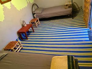 Postel nebo postele na pokoji v ubytování Auberge L'Oasis Mhamid