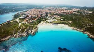 an aerial view of a beach with blue water at TrèSOR in Santa Teresa Gallura