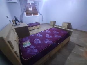 Tempat tidur dalam kamar di Villa haydi