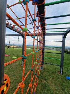 a playground with an obstacle course at Stodoły z widokiem in Nowy Targ