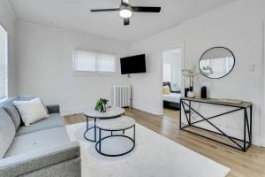 a living room with a couch and a table at Mayflower 301 Breathtaking 2bed1bth in Rochester
