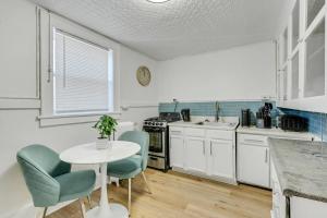 a kitchen with a table and chairs and a sink at Mayflower 301 Breathtaking 2bed1bth in Rochester