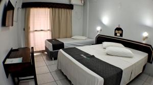 Postel nebo postele na pokoji v ubytování Hotel LF By Feliciano