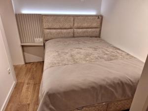 a small bed in a small room at Studio apartman M in Posušje