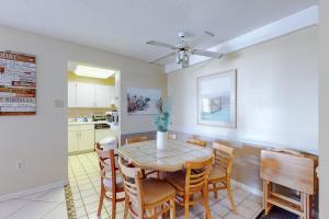 a kitchen and dining room with a table and chairs at Braemar Towers 902 in Ocean City