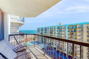 a balcony with chairs and a view of the ocean at Braemar Towers 902 in Ocean City