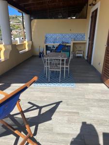 a view of a patio with a table and chairs at Casa ISABELLA loc turist br in Lipari