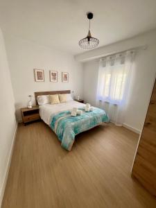 Łóżko lub łóżka w pokoju w obiekcie VuT El Refugio de Santiago