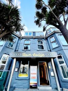 a blue building with a sign on the front of it at Town Lodge in Newquay