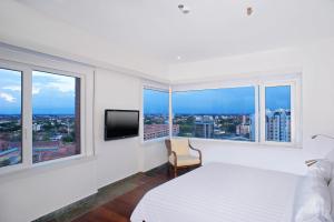 Ένα ή περισσότερα κρεβάτια σε δωμάτιο στο Hotel Spiwak Chipichape Cali