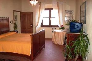 Postel nebo postele na pokoji v ubytování Agriturismo Corte Virgiliana