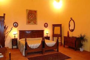 Postel nebo postele na pokoji v ubytování Agriturismo Corte Virgiliana